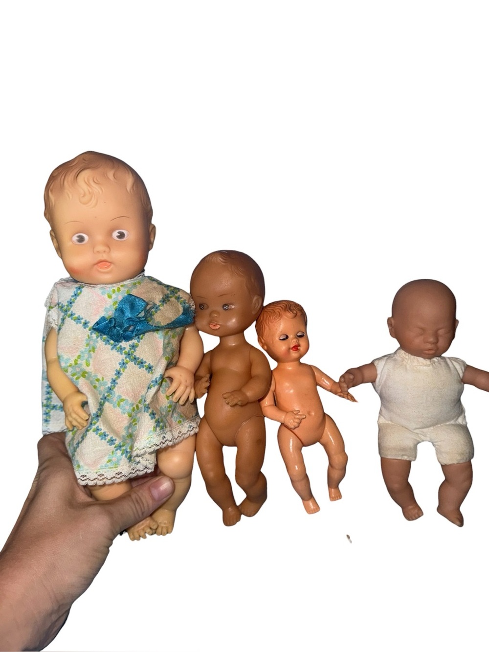 Lot of four vintage plastic dolls